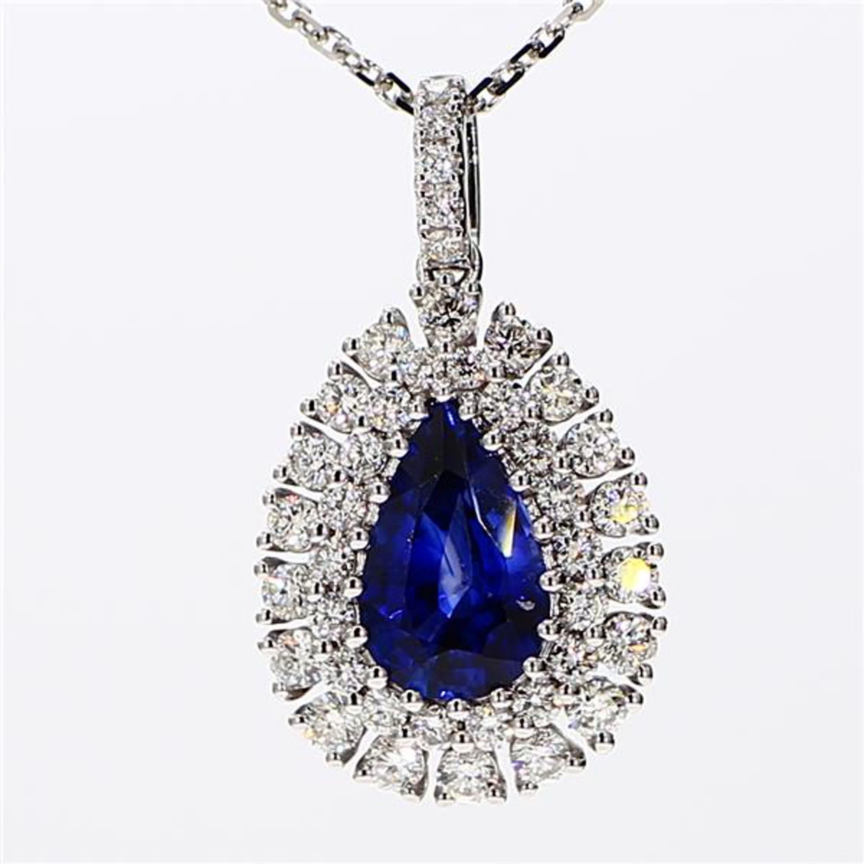 RareGemWorld's classic sapphire pendant. Mounted in a beautiful 18K White Gold setting with a natural pear cut blue sapphire. The sapphire is surrounded by natural round white diamond melee. This pendant is guaranteed to impress and enhance your