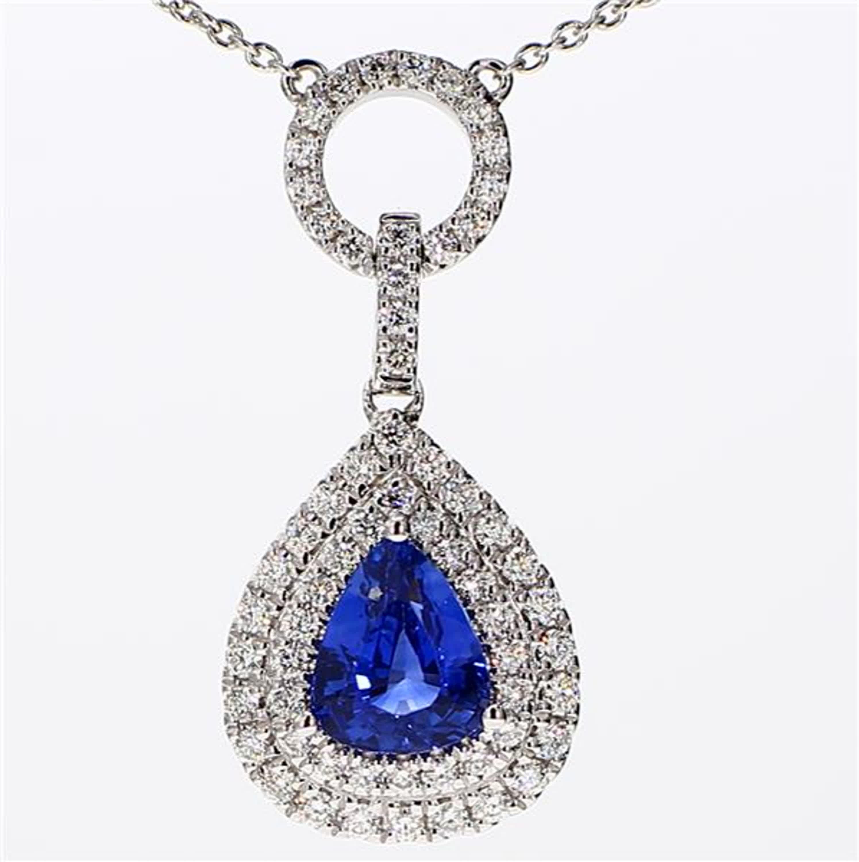 RareGemWorld's classic sapphire pendant. Mounted in a beautiful 18K White Gold setting with a natural pear cut blue sapphire. The sapphire is surrounded by natural round white diamond melee. This pendant is guaranteed to impress and enhance your