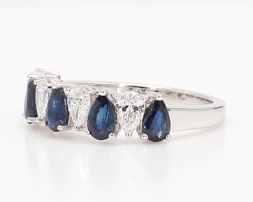 RareGemWorld's classic sapphire ring. Mounted in a beautiful 18K White Gold setting with natural pear cut blue sapphires complimented by natural pear cut white diamonds. This ring is guaranteed to impress and enhance your personal collection!

Total