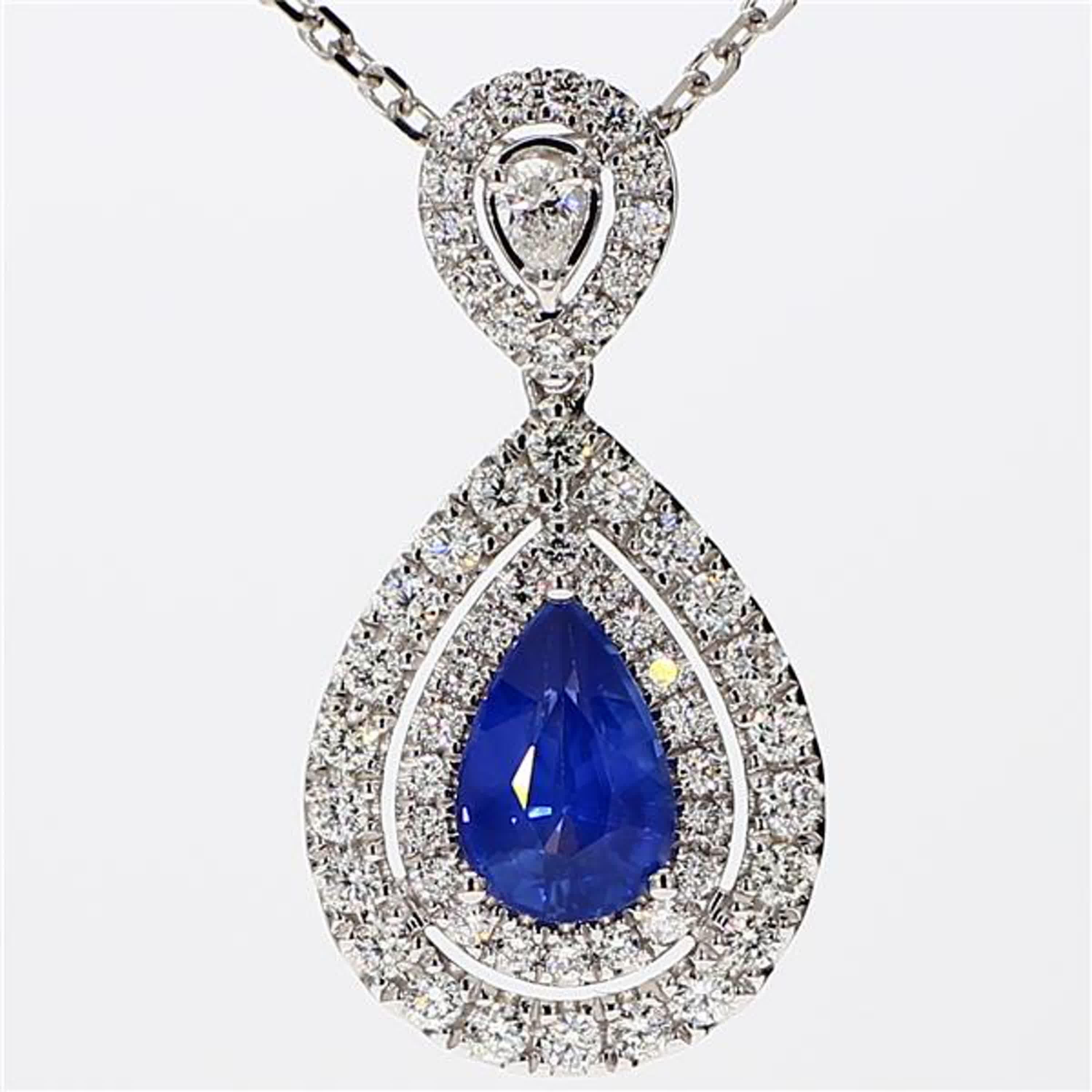 RareGemWorld's classic sapphire pendant. Mounted in a beautiful 18K White Gold setting with a natural pear cut blue sapphire. The sapphire is surrounded by natural round white diamond melee as well as a natural pear cut white diamond. This pendant