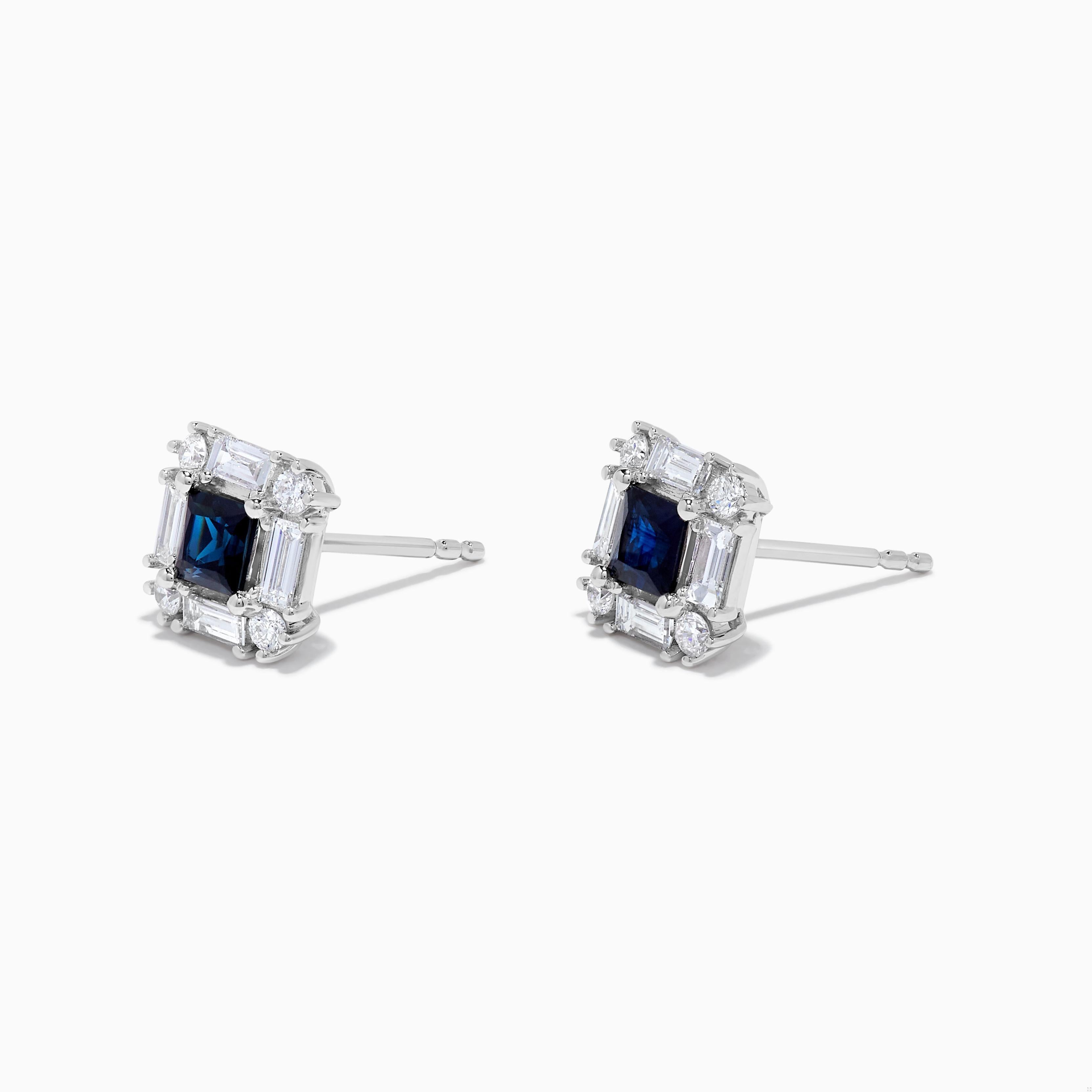 RareGemWorld's classic sapphire earrings. Mounted in a beautiful 18K White Gold setting with natural princess cut blue sapphires. The sapphires are surrounded by natural round white diamond melee and natural baguette cut white diamonds. These