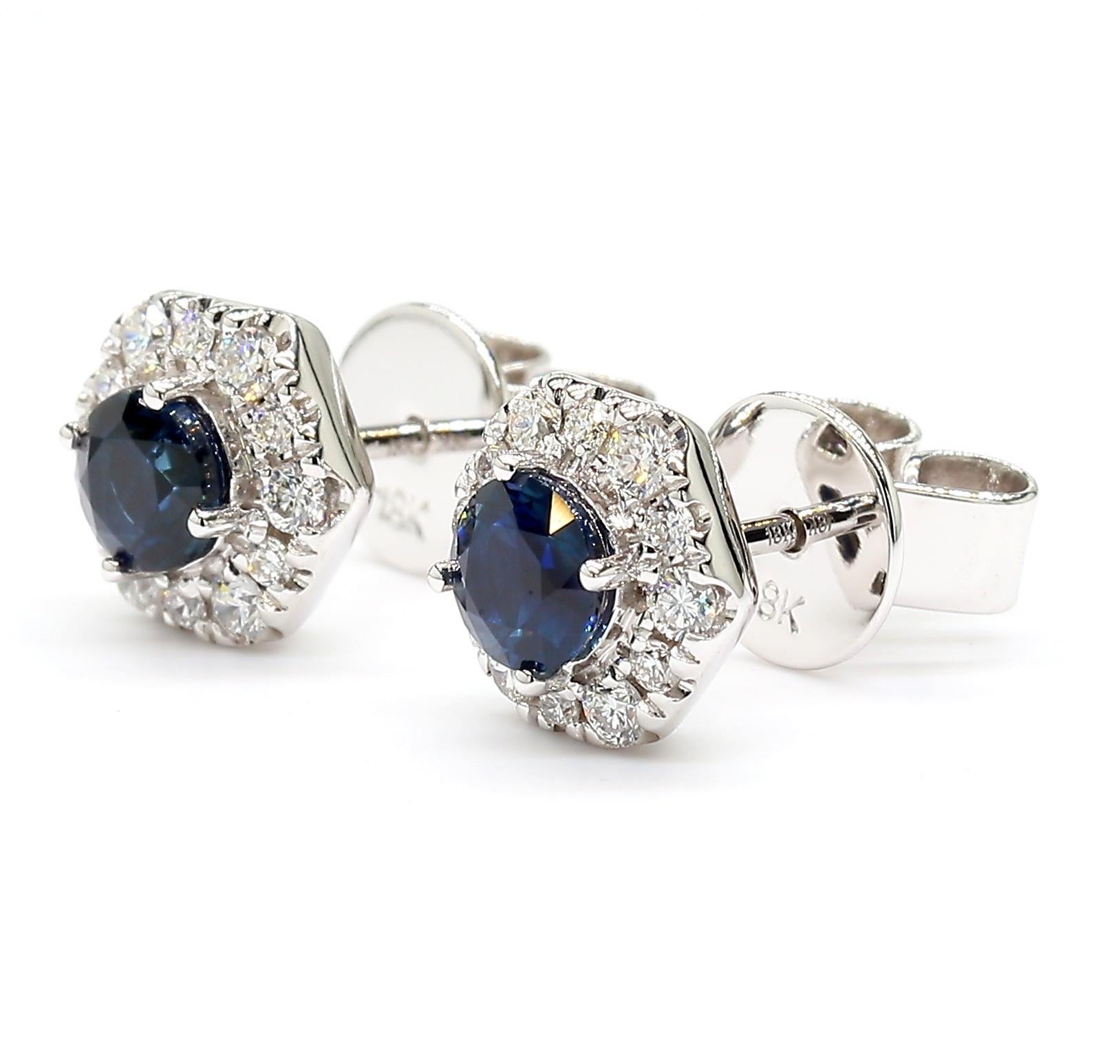 RareGemWorld's beautiful sapphire earrings. Mounted in a beautiful 18K White Gold setting with natural round cut blue sapphires complimented by natural round white diamond melee. These earrings are guaranteed to impress and enhance your personal
