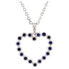 Pendentif en or de 0.37 carat poids total avec saphir rond bleu naturel et diamant blanc