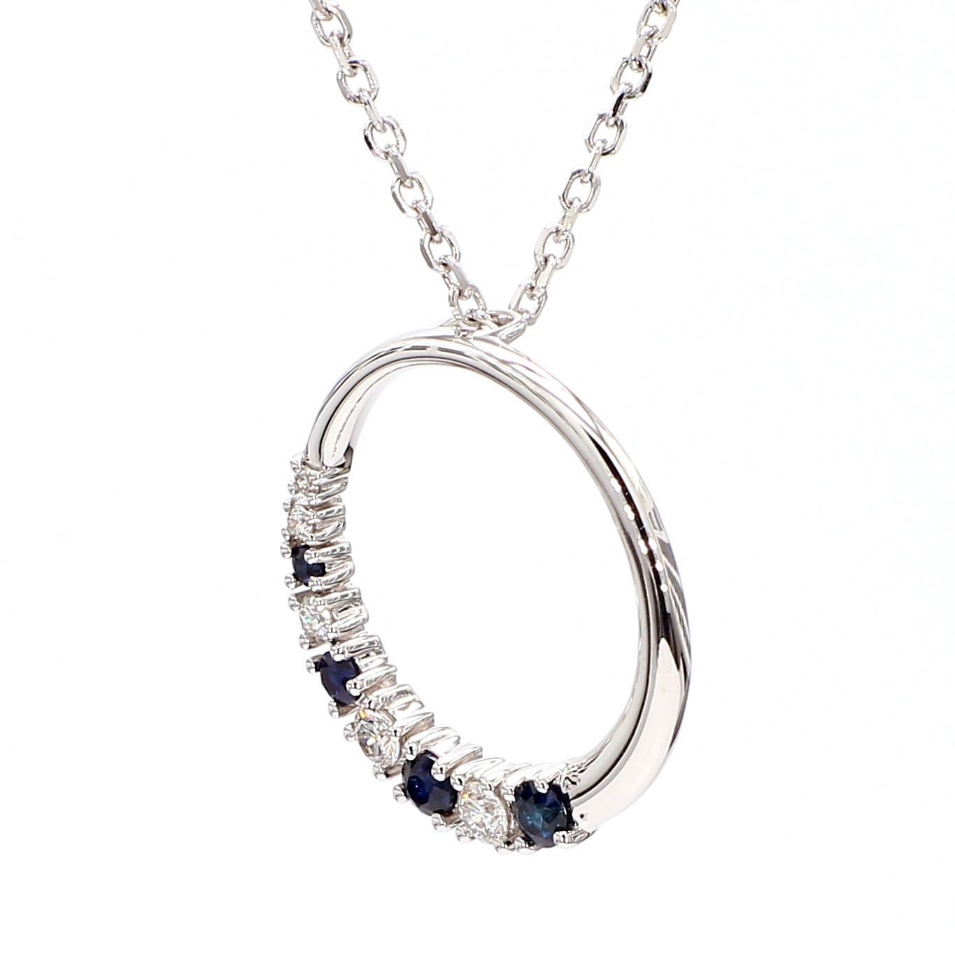 RareGemWorld's beautiful sapphire pendant. Mounted in a beautiful 14K White Gold setting with a natural round cut blue sapphires complimented by natural round cut white diamond melee. This pendant is guaranteed to impress and enhance your personal