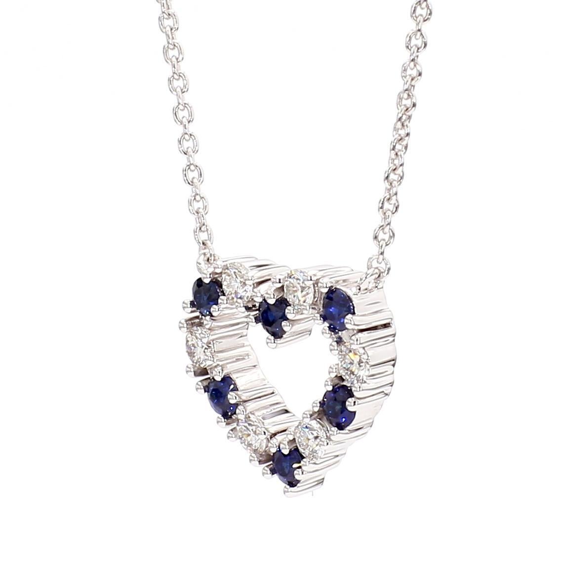 RareGemWorld's classic sapphire pendant. Mounted in a beautiful 18K White Gold setting with a natural round cut blue sapphires complimented by natural round cut white diamond melee. This pendant is guaranteed to impress and enhance your personal