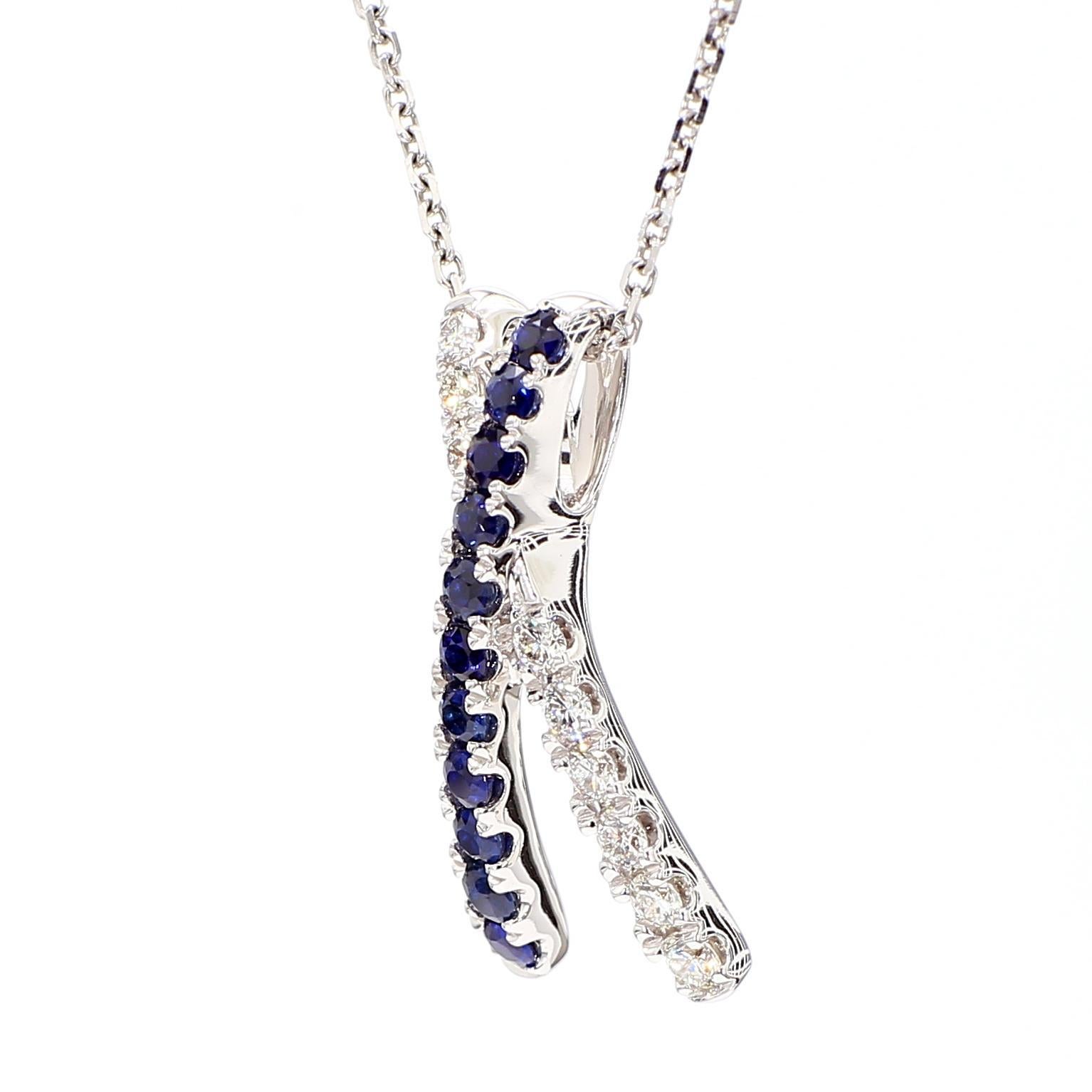 RareGemWorld's beautiful sapphire pendant. Mounted in a beautiful 18K White Gold setting with a natural round cut blue sapphires complimented by natural round cut white diamond melee. This pendant is guaranteed to impress and enhance your personal