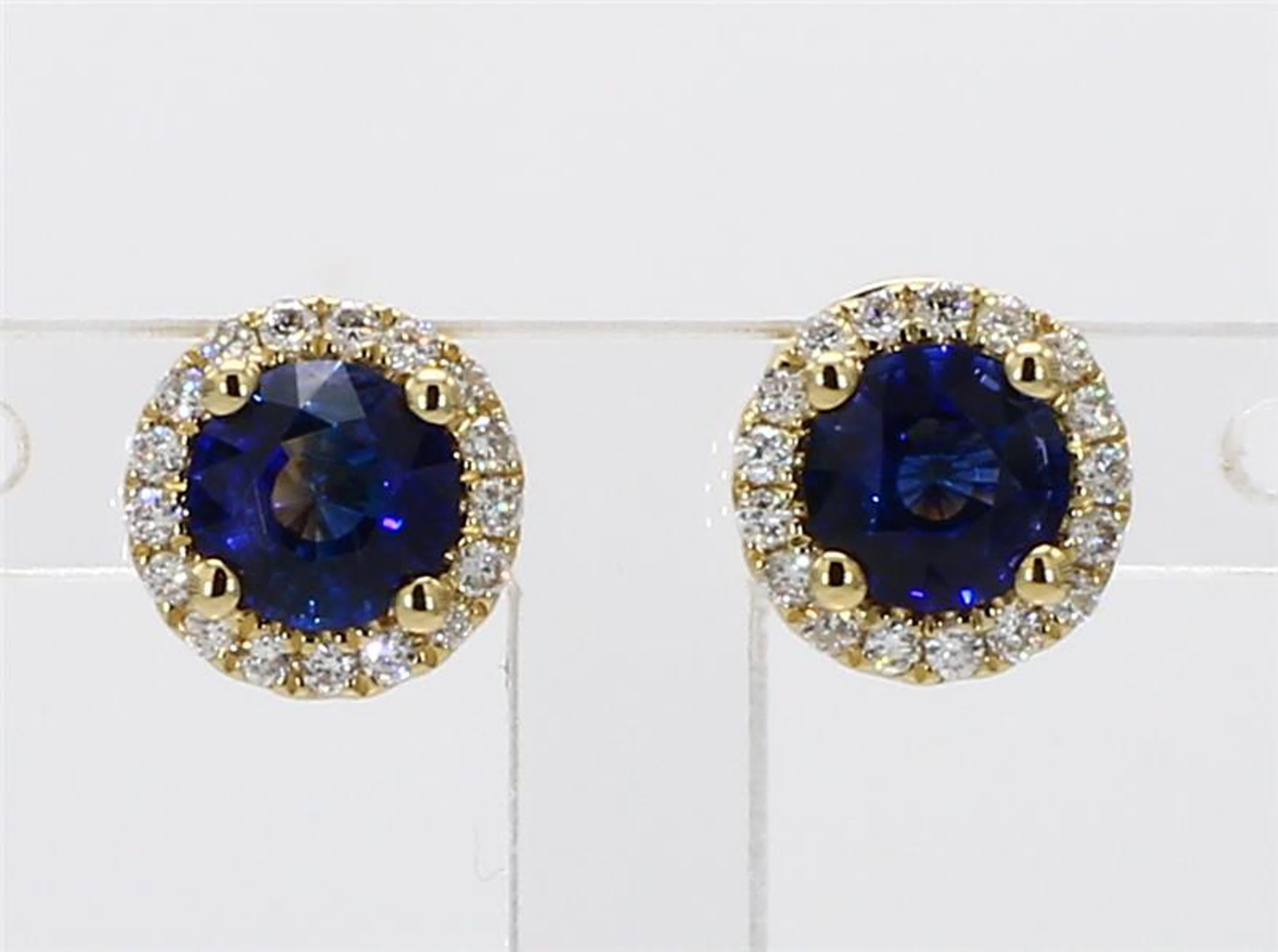 RareGemWorld's classic sapphire earrings. Mounted in a beautiful 14K Yellow Gold setting with natural round cut blue sapphires. The sapphires are surrounded by natural round white diamond melee in a beautiful single halo. These earrings are