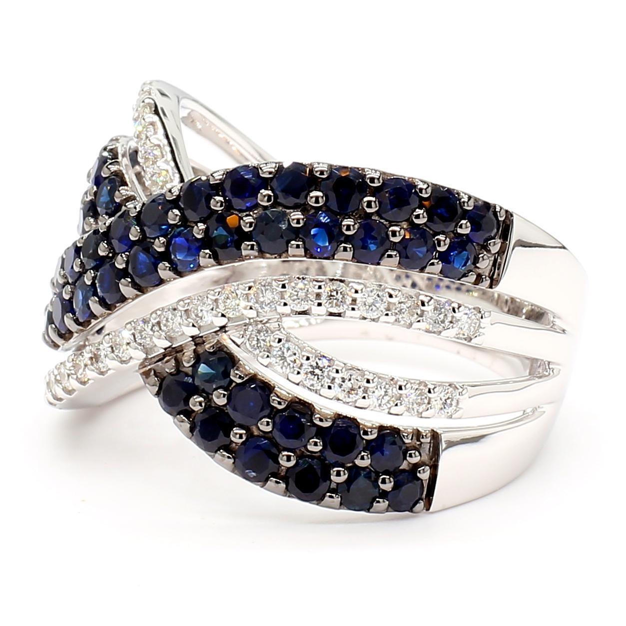 RareGemWorld's intriguing sapphire ring. Mounted in a beautiful 14K White Gold setting with natural round cut blue sapphires complimented by natural round white diamond melee. This ring is guaranteed to impress and enhance your personal
