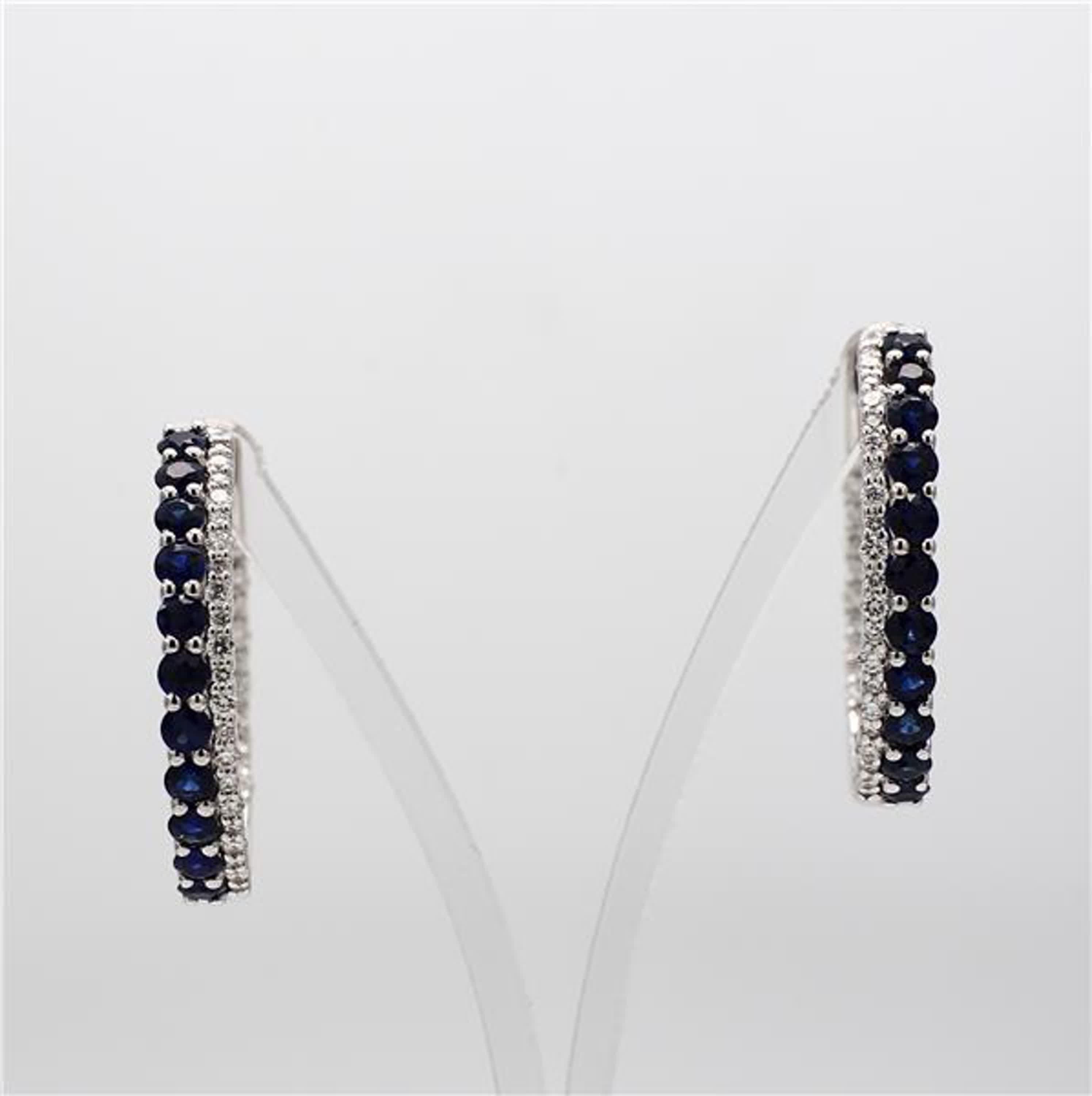 RareGemWorld's classic sapphire earrings. Mounted in a beautiful 14K White Gold setting with natural round cut blue sapphires complimented by natural round white diamond melee. These earrings are guaranteed to impress and enhance your personal