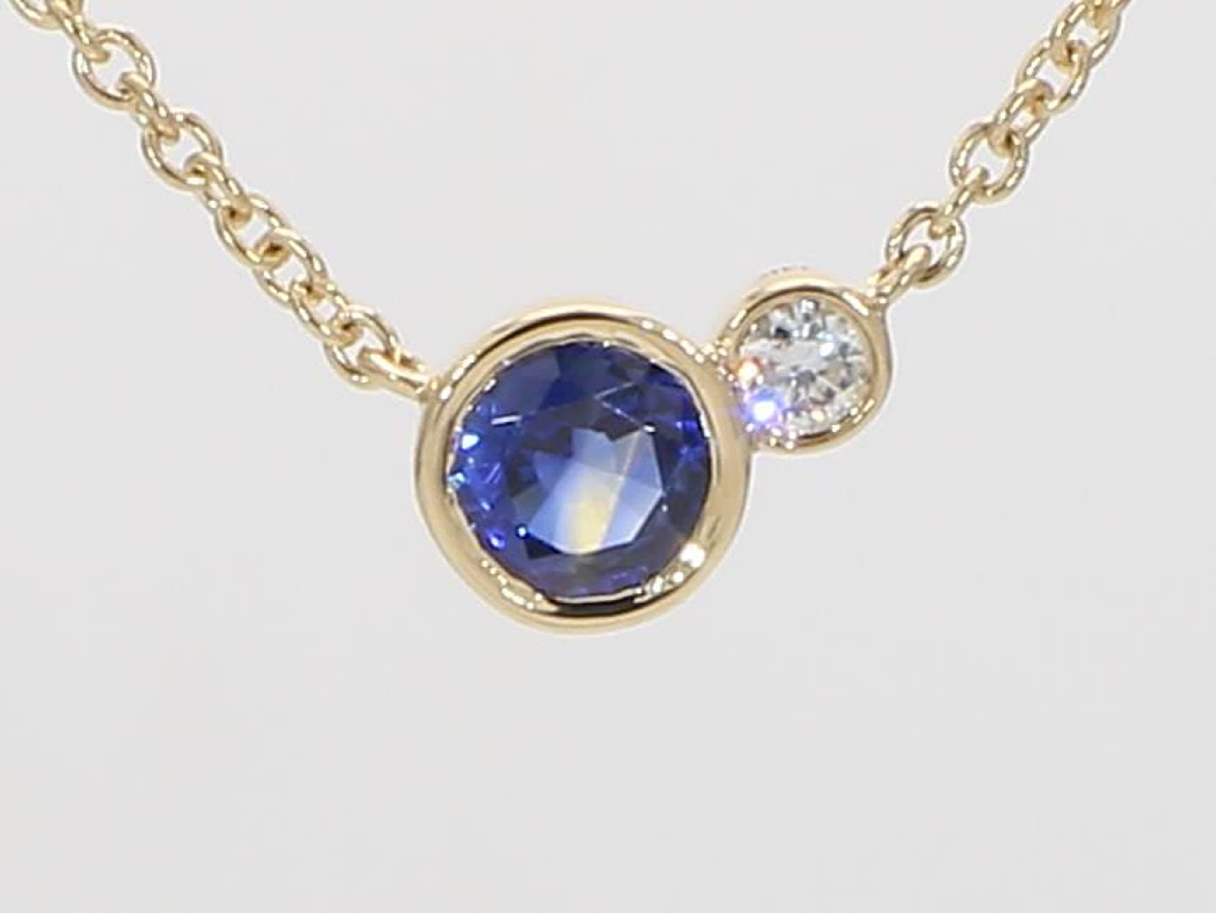RareGemWorld's classic sapphire pendant. Mounted in a beautiful 14 Yellow Gold setting with a natural round cut blue sapphire. The sapphire is complimented by a natural round cut white diamond. This pendant is guaranteed to impress and enhance your