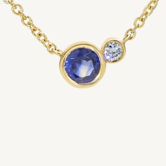 Natural Blue Round Sapphire and White Diamond .36 Carat TW Gold Drop Pendant