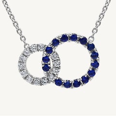 Natural Blue Round Sapphire and White Diamond .36 Carat TW White Gold Pendant