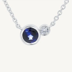 Natural Blue Round Sapphire and White Diamond .39 Carat TW Gold Drop Pendant