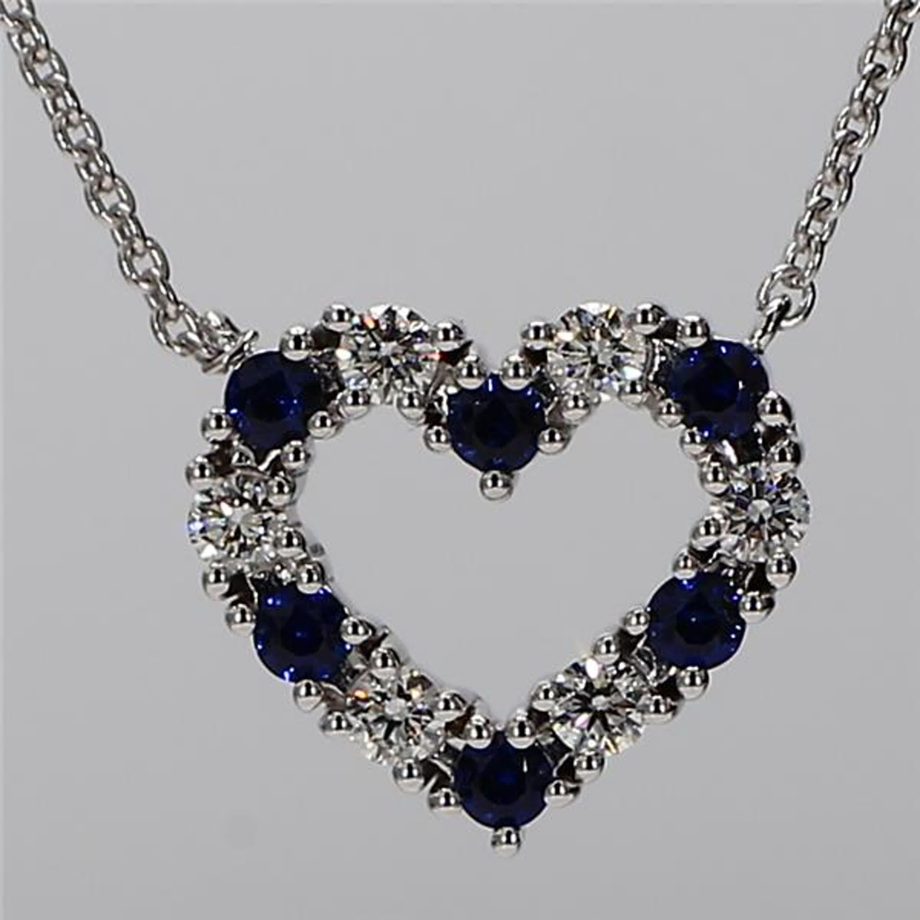 RareGemWorld's classic sapphire pendant. Mounted in a beautiful 18K White Gold setting with a natural round cut blue sapphires complimented by natural round cut white diamond melee in a beautiful heart-shape. This pendant is guaranteed to impress