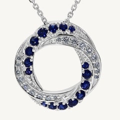 Natural Blue Round Sapphire and White Diamond .78 Carat TW White Gold Pendant