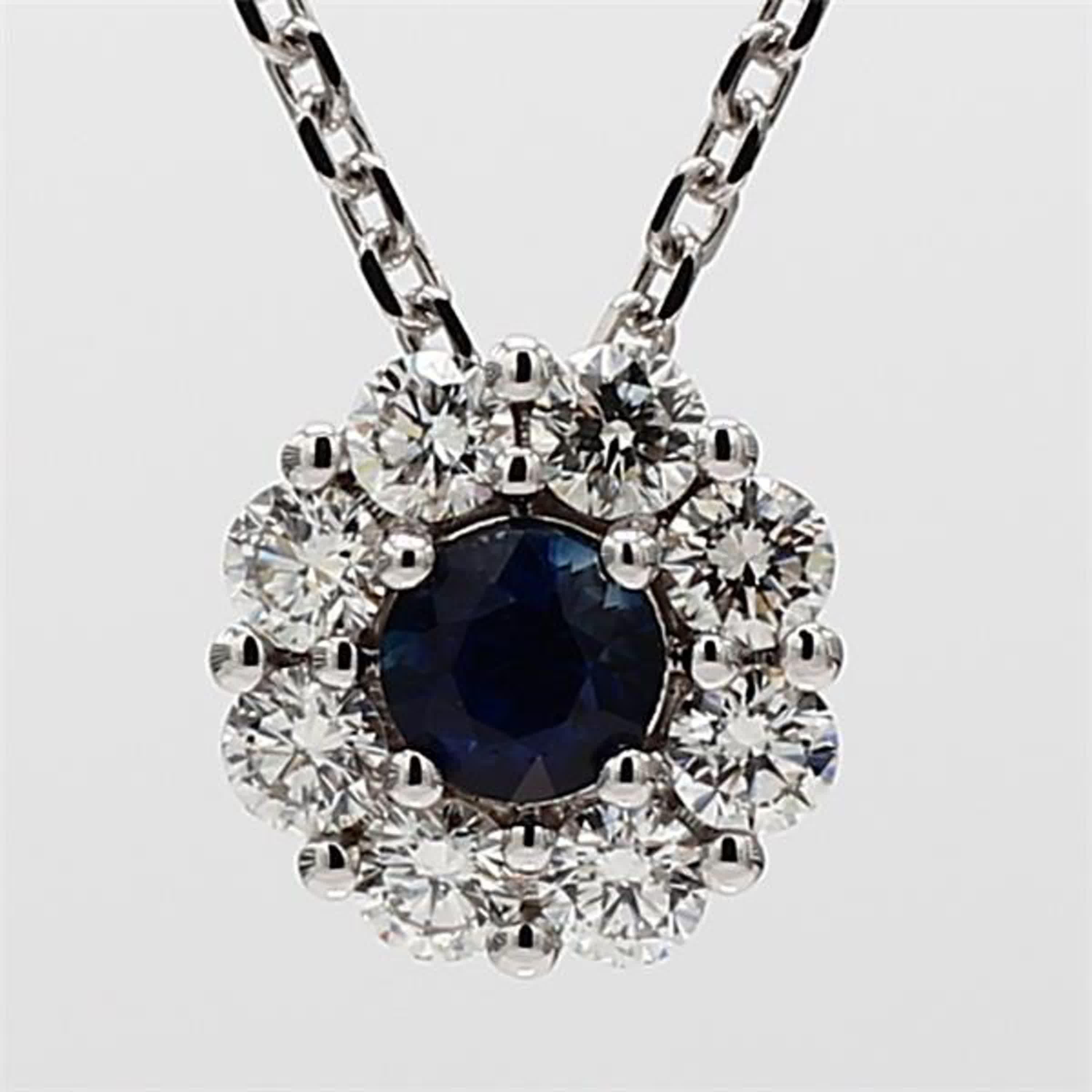 RareGemWorld's classic sapphire pendant. Mounted in a beautiful 14K White Gold setting with a natural round cut blue sapphire. The sapphire is surrounded by natural round white diamond melee in a beautiful single halo. This pendant is guaranteed to