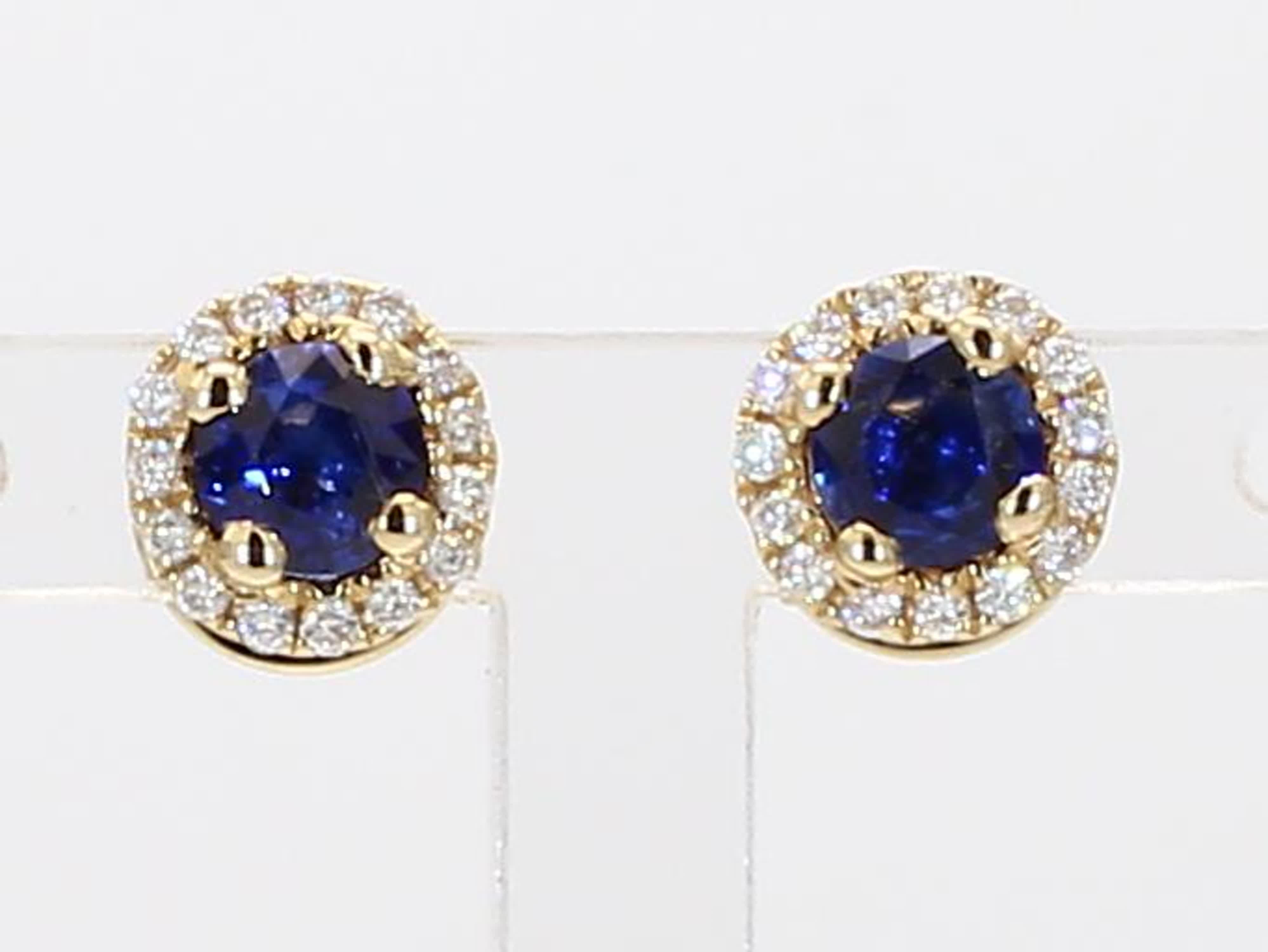 RareGemWorld's classic sapphire earrings. Mounted in a beautiful 14K Yellow Gold setting with natural round cut blue sapphires. The sapphires are surrounded by natural round white diamond melee in a beautiful single halo. These earrings are