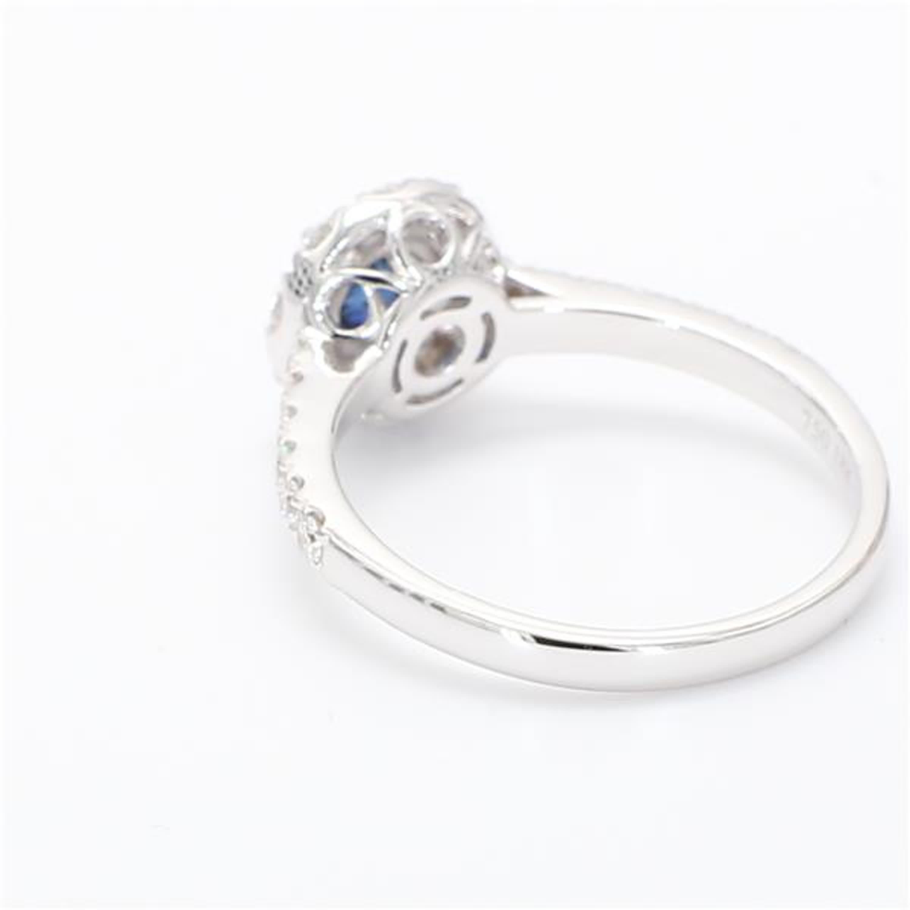 Contemporary Natural Blue Round Sapphire and White Diamond .93 Carat TW White Gold Ring For Sale