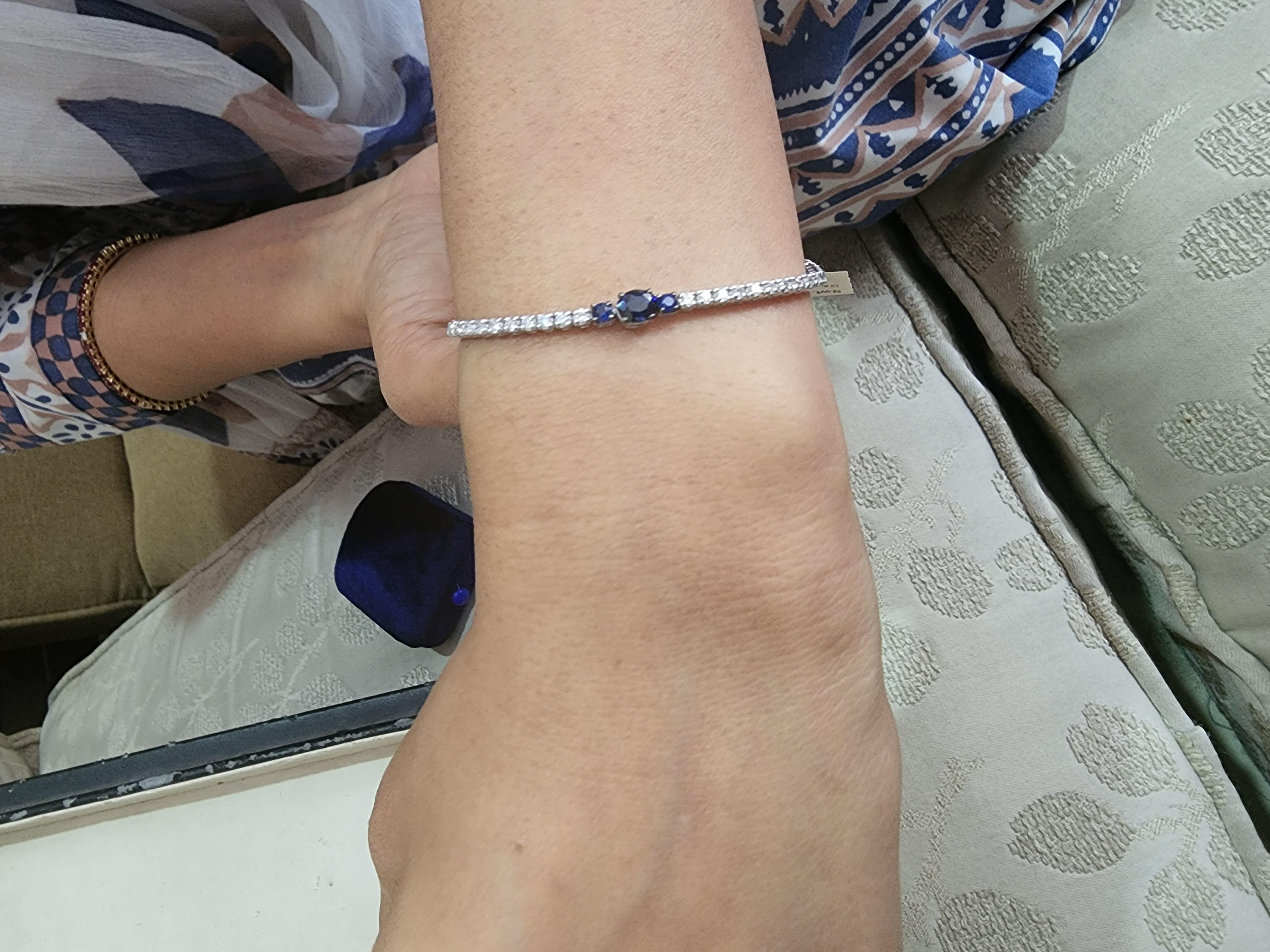 This is an amazing natural blue sapphire tennis bracelet with 1.67 carats of blue sapphire and white diamond are 1.47 carats. Gold Weight is 6.98 gms (18k)

It’s very hard to capture the true color and luster of the stone, I have tried to add