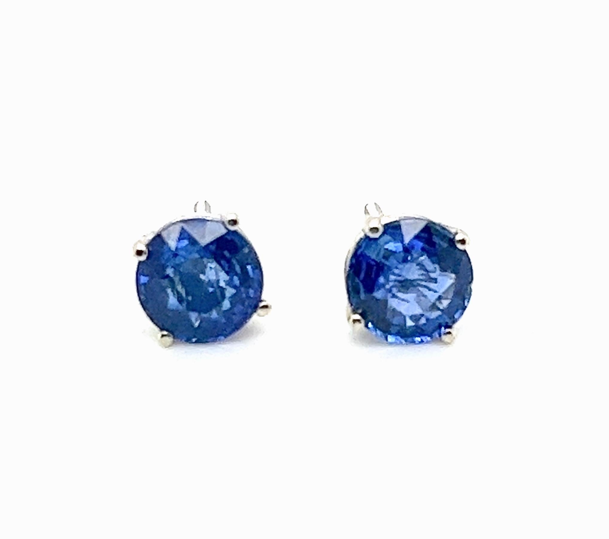 Indulge in the classic elegance of this natural earth mined Blue Sapphire pair, weighing a total of 2.03 carats, with an exquisite blue hue and tone that's sure to turn heads. Set within a simple yet sophisticated 4 prong white 14kt gold basket,
