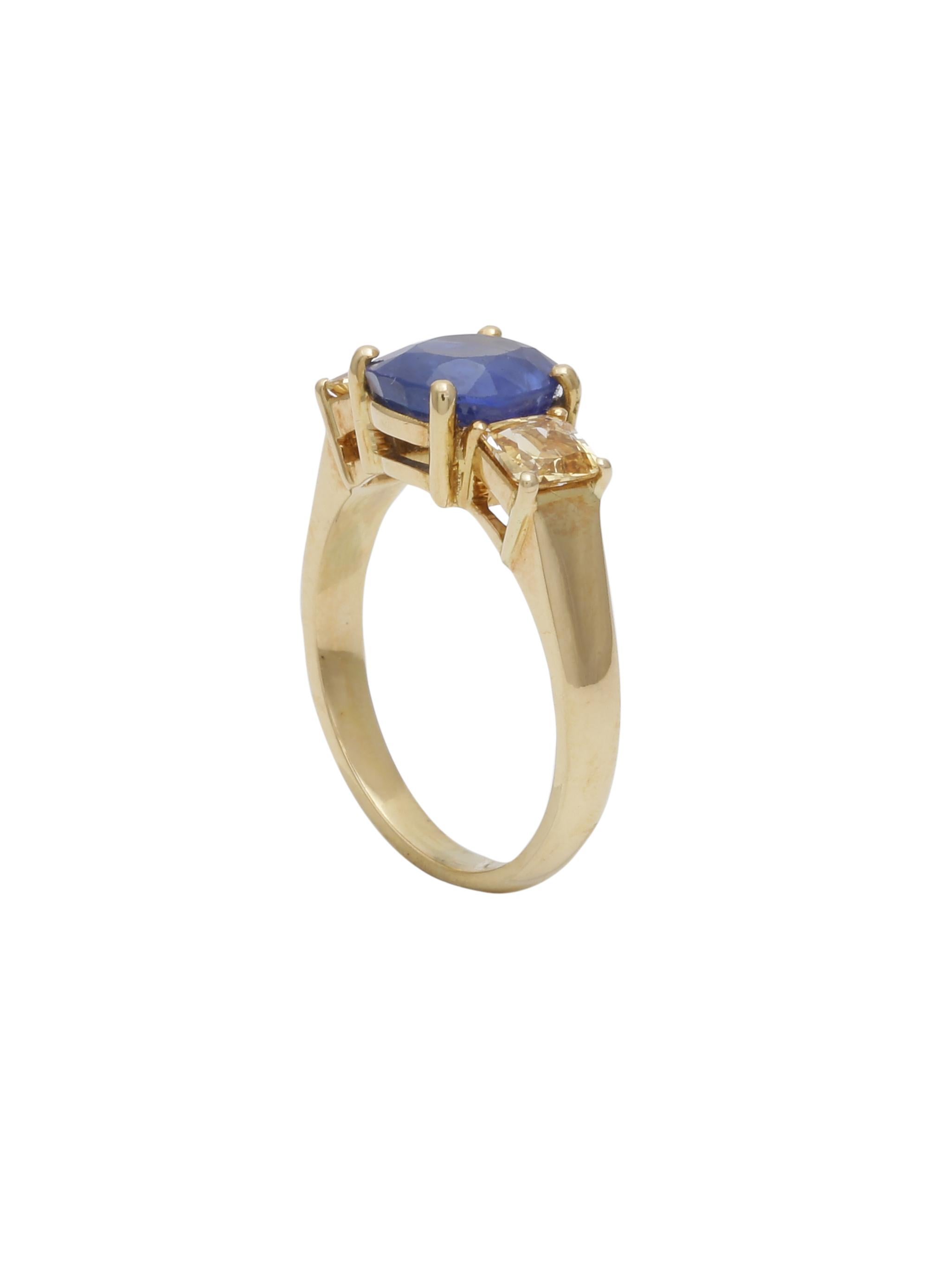 Beautiful 3 stone ring with a 2.51 carats Natural Sapphire centre and 2 small 0.78 carats Yellow Sapphires on the sides. 

For someone looking for a out of the box engagement ring. A everyday wearable ring.

The centre Blue Sapphire is Natural and