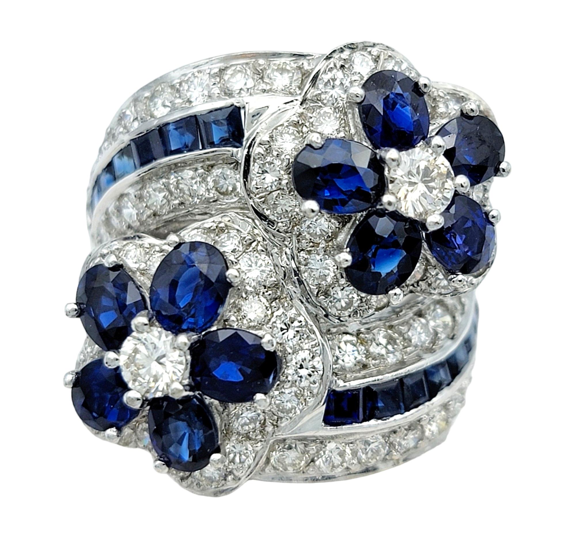 Ringgröße: 6.75

Dieser wunderschöne Blumenring mit blauem Saphir und Diamanten ist ein fesselndes Schmuckstück, das die Faszination von Saphiren und Diamanten in einem atemberaubenden Blumendesign vereint. Dieser Ring aus elegantem 18-karätigem
