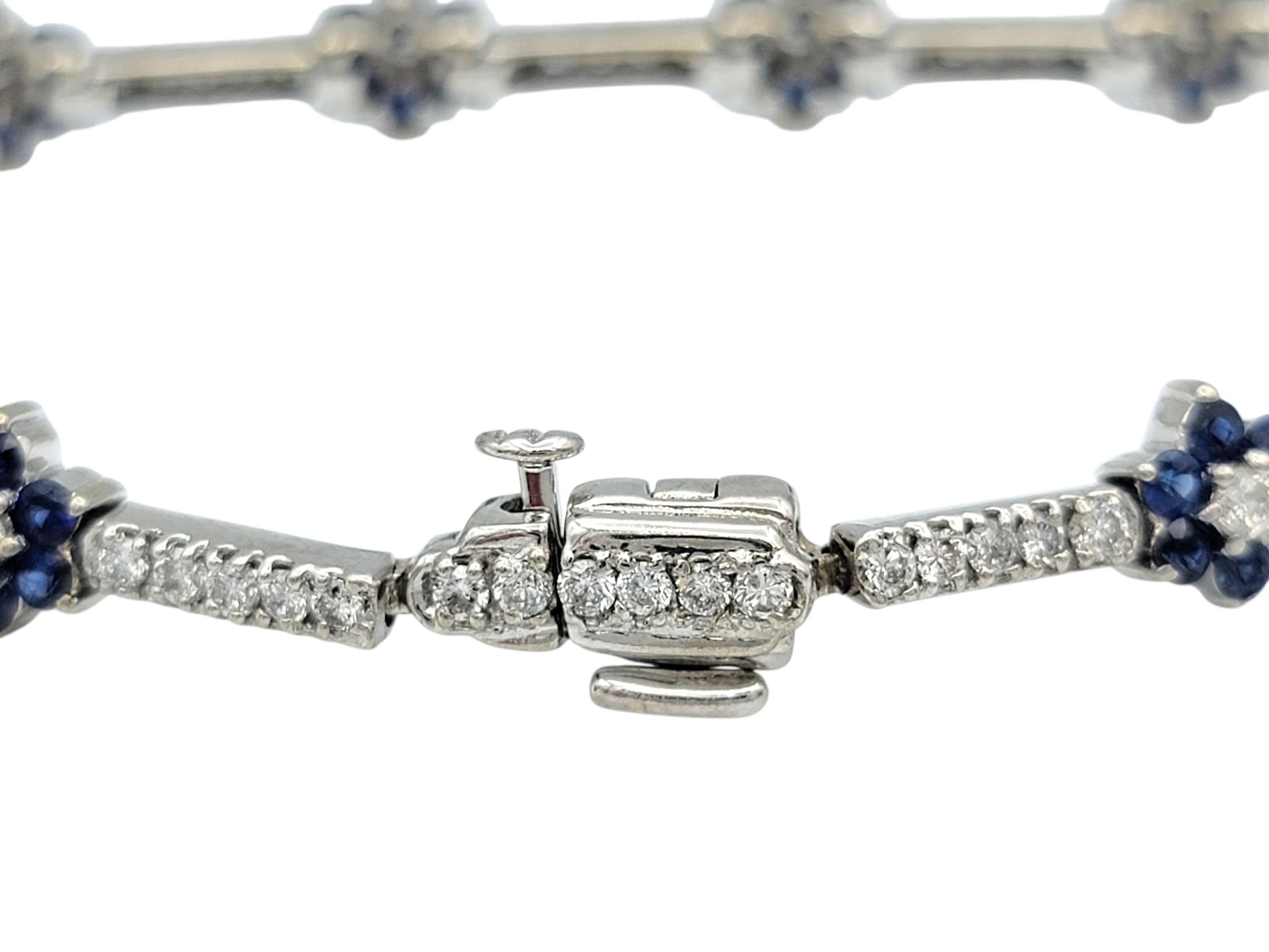 Contemporary Natural Blue Sapphire and Diamond Flower Motif Link Bracelet 14 Karat White Gold For Sale