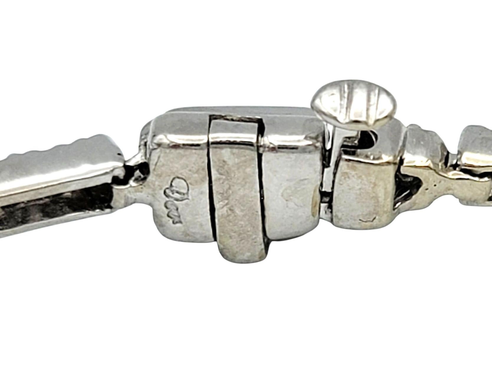 Natural Blue Sapphire and Diamond Flower Motif Link Bracelet 14 Karat White Gold In Good Condition For Sale In Scottsdale, AZ