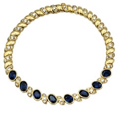 Armband aus poliertem 18 Karat Gelbgold mit natürlichem blauem Saphir und Diamanten