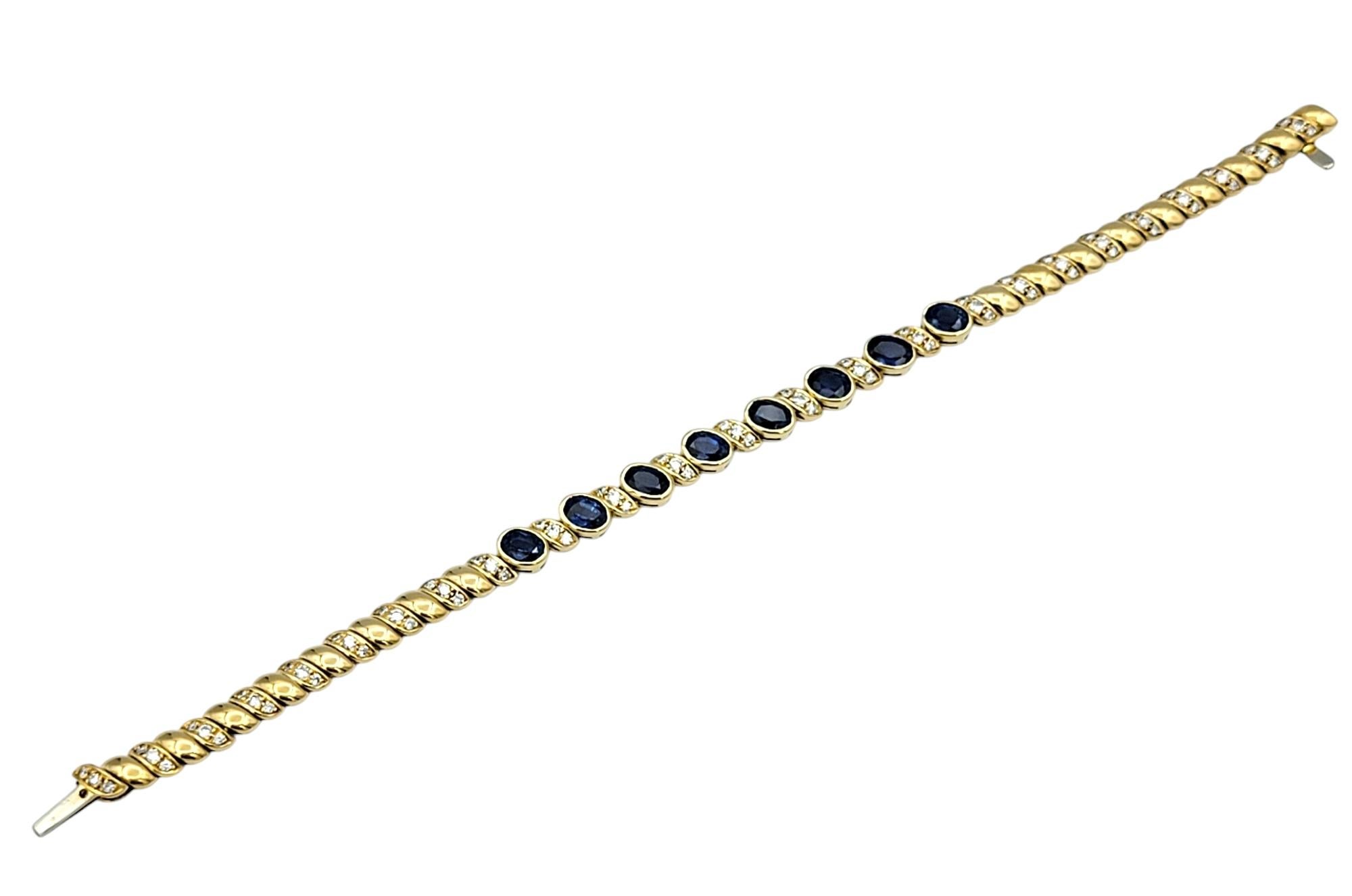 Oval Cut Natural Blue Sapphire and Diamond Line Bracelet in Polished 18 Karat Yellow Gold For Sale
