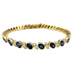 Natural Blue Sapphire and Diamond Line Bracelet in Polished 18 Karat Yellow Gold