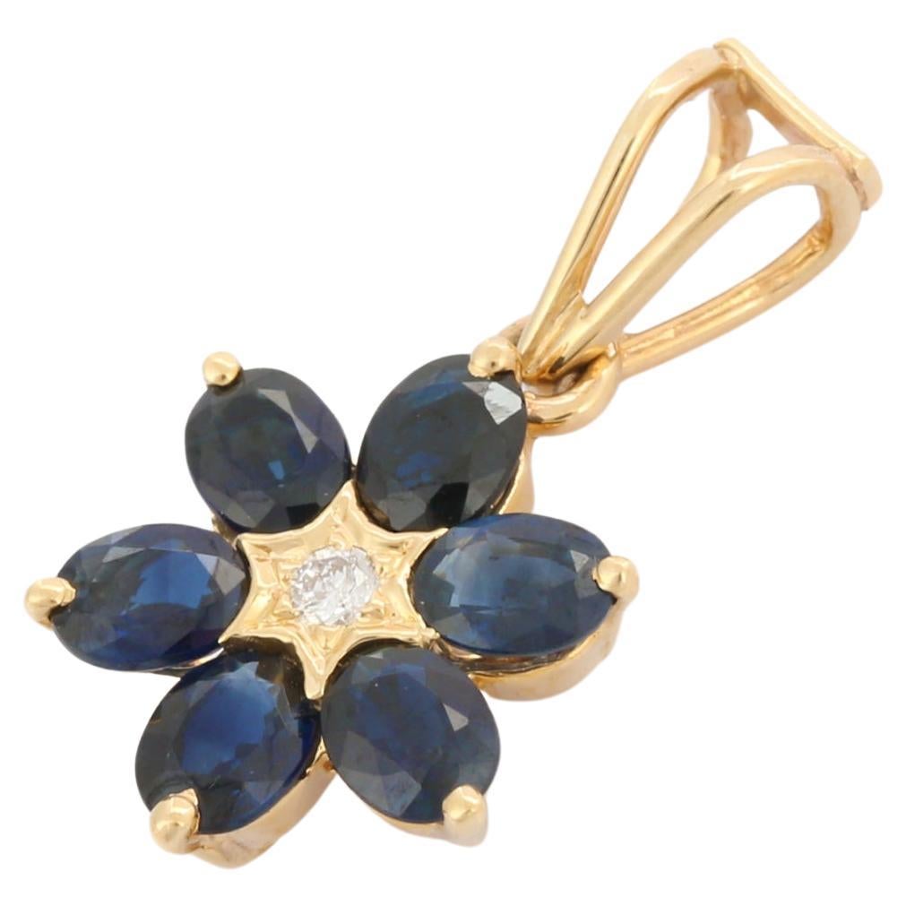 Minimalistischer floraler Anhänger aus 14 Karat Gelbgold mit blauem Saphir und Diamant  im Angebot