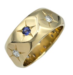 Blue Sapphire and Diamond Star Motif Angular Band Ring in 14 Karat Yellow Gold