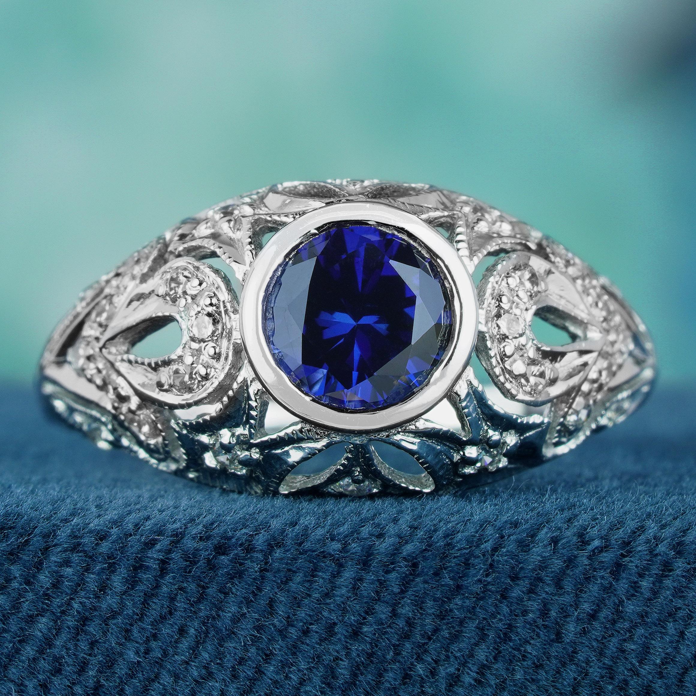 Add a delicate and unique aesthetic to your hand with this filigree ring crafted in elegant white gold, this exquisite ring showcases a breathtaking natural blue sapphire as its centerpiece. Intricate filigree detailing surrounding the sapphire