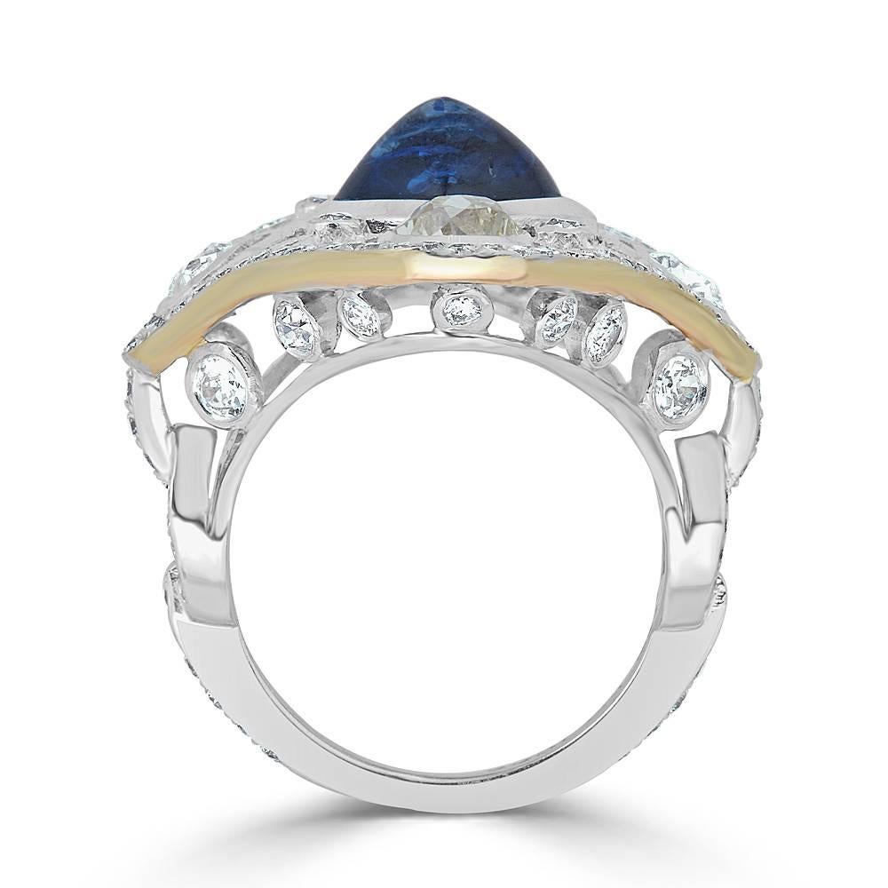 Natural Blue Sapphire and Old Mine Cut Diamond Cocktail Ring featuring 2.01 carats Total Old Mine Diamonds and a 3.73 carat Natural Blue Sugarloaf Sapphire. Handcrafted in 18k white gold with an 18k Rose gold under gallery. The ring is currently a