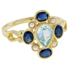 Vintage-Cluster-Ring aus 9 Karat Gold mit natürlichem blauem Saphir, blauem Topas und Perle im Vintage-Stil