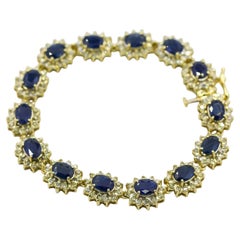 Bracciale tennis con zaffiro blu naturale e diamanti da 10,50 carati, in oro giallo 14 carati