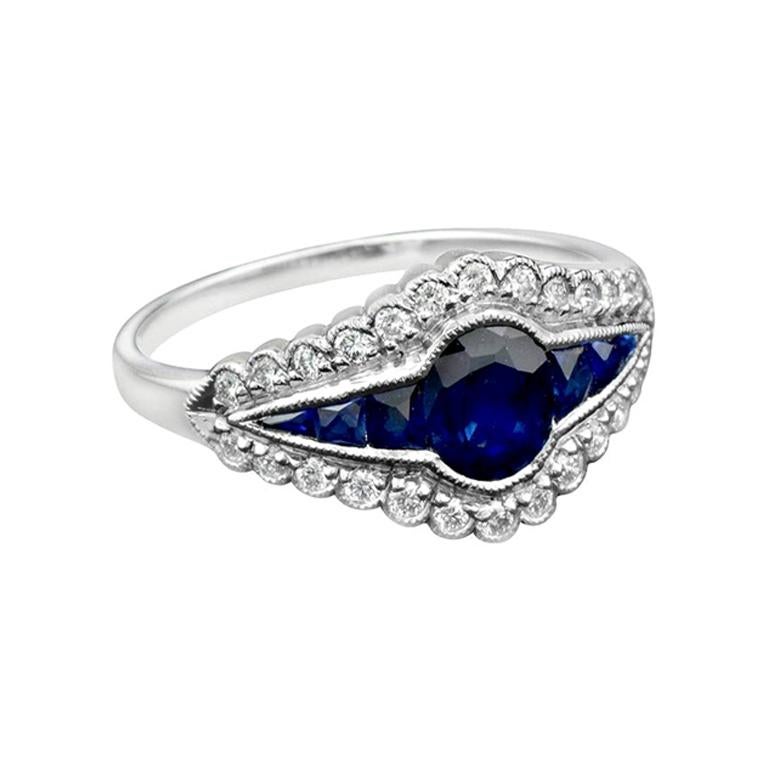Bague de style Art déco en or 18 carats avec saphir bleu naturel et halo de diamants
