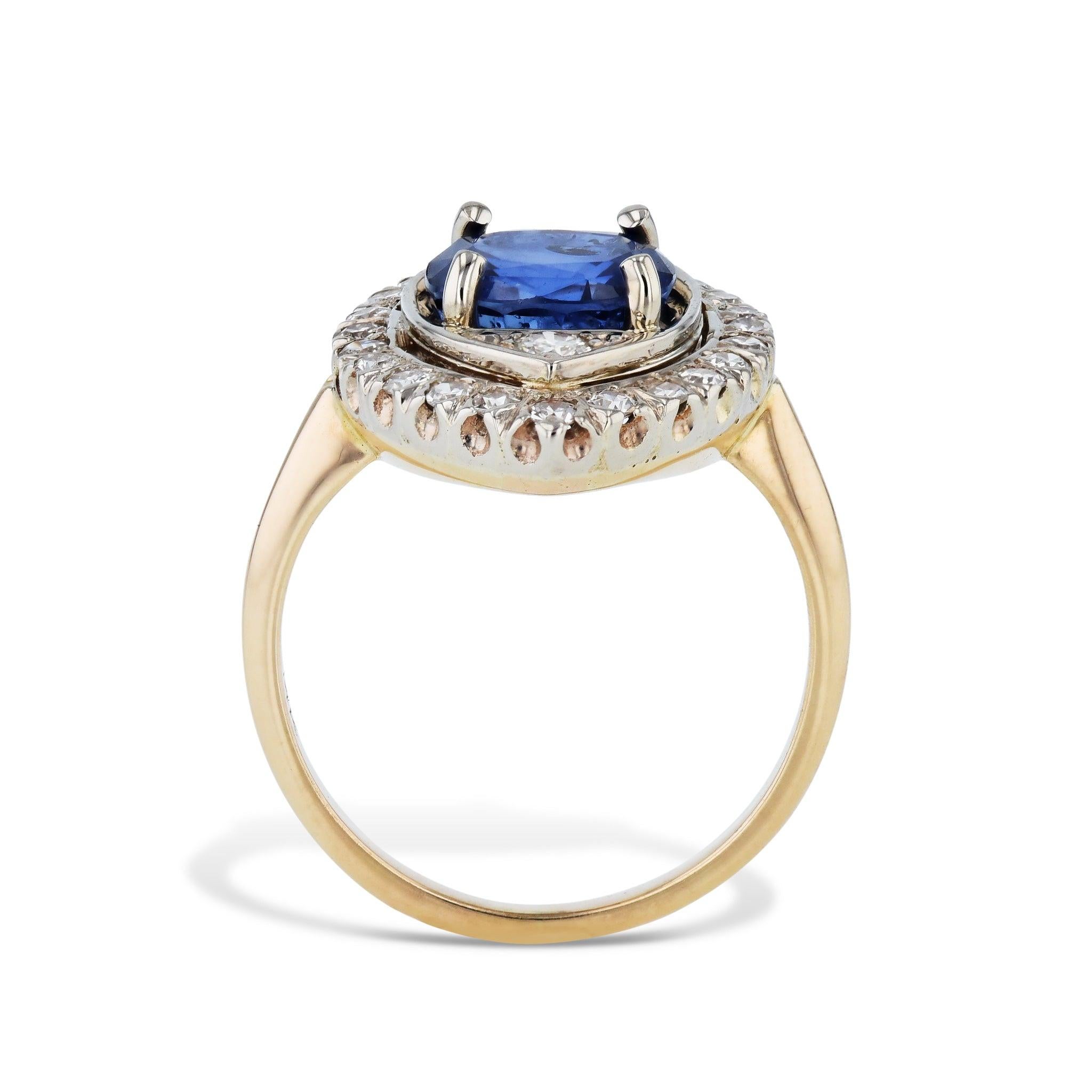 Fall in love with this stunning Natural Blue Sapphire Diamond Estate Ring. Crafted  in 14kt White & Yellow gold with a 3.66ct Titanium Diffused Natural Blue Sapphire, and 26 Single cut Diamonds. The Diamonds surround the center Sapphire to create a