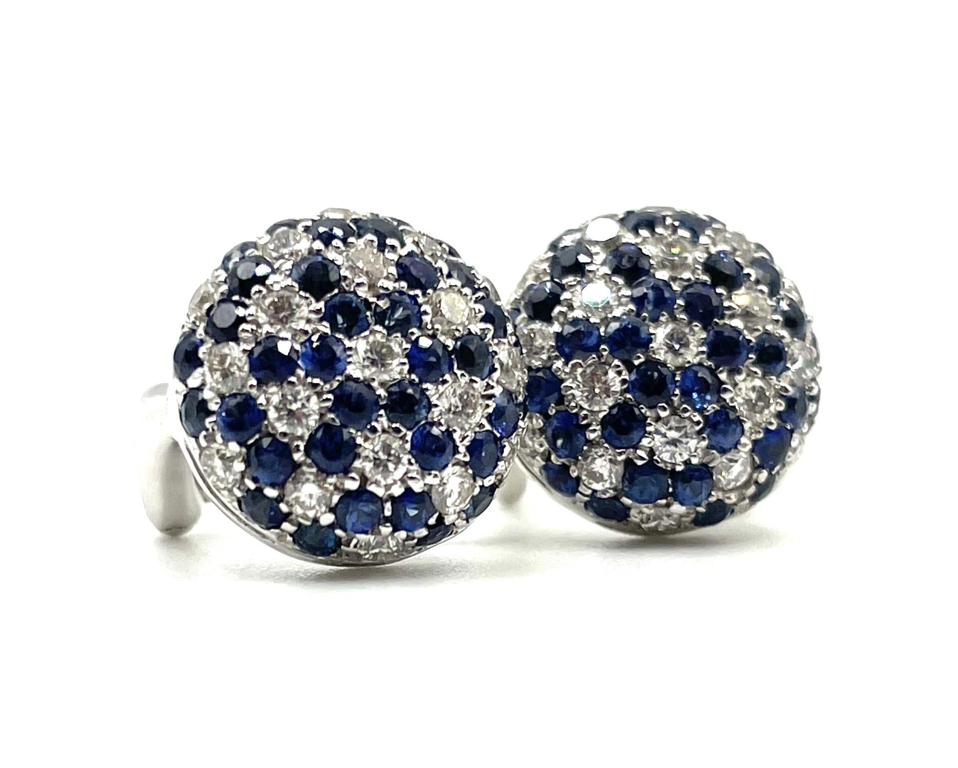 A pair of 18kt white gold, natural blue sapphire and brillant cut  diamond earrings with a  straight  post and omega clip system. Beautiful to wear on any occasion.

72  natural blue sapphires 1.50ct total weight

38 brilliant cut diamonds 0.60ct