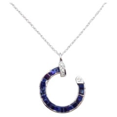 Colgante de zafiro azul natural y diamante en oro de 18k