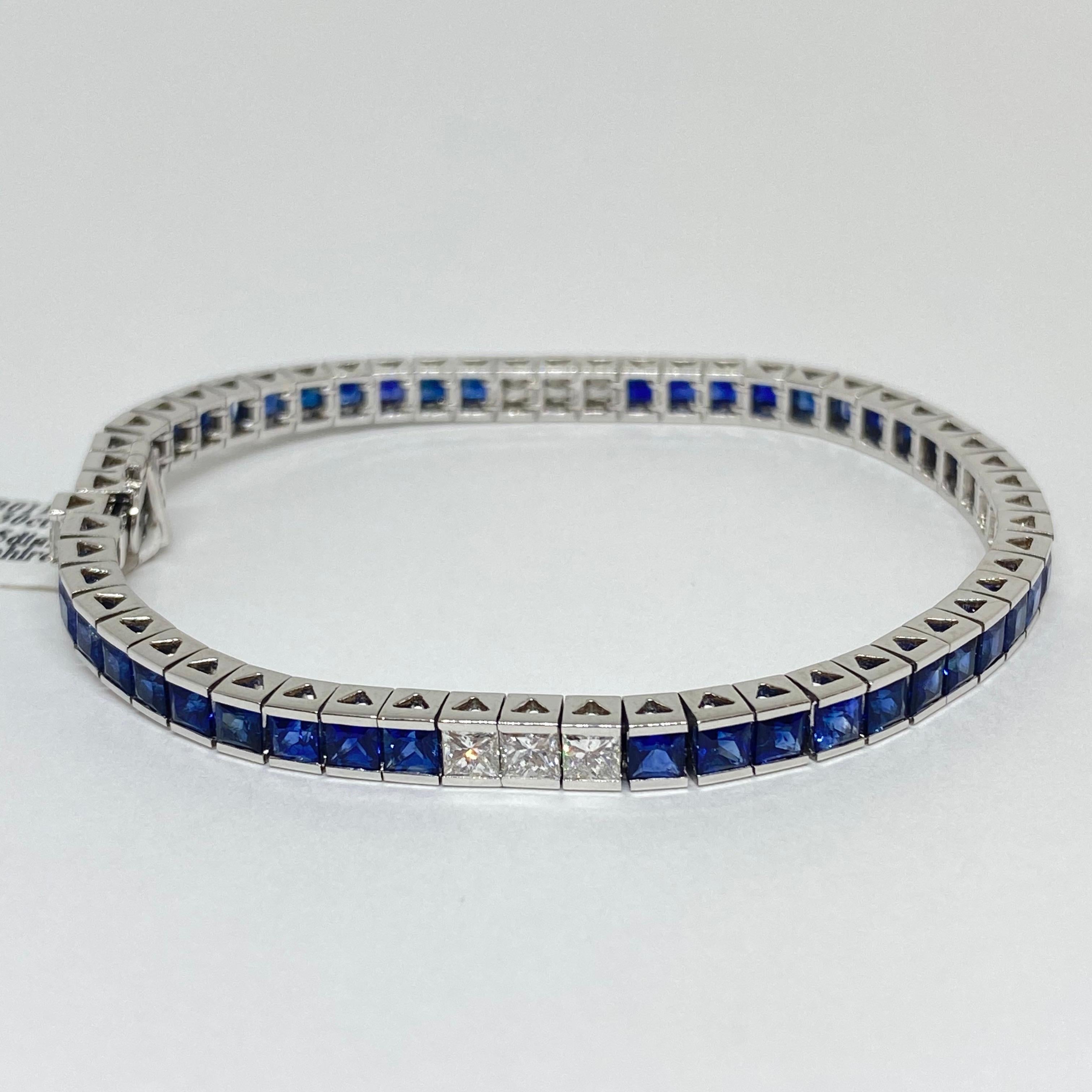 Beautiful vibrant blue sapphire and diamond tennis bracelet designed in 18 karat white gold. The bracelet contains princess square cut channel set natural sapphires and diamonds. The sapphires have a total weight of 9.30 carats, and the diamonds