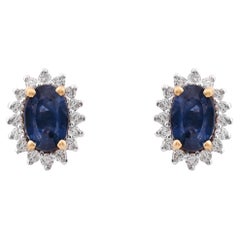 Pendiente de zafiro azul natural con diamante de 0,25 cts en oro de 18k