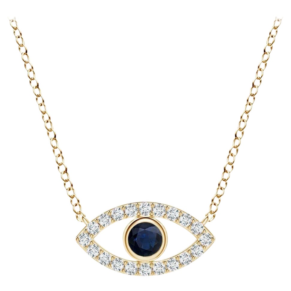 Ciondolo con zaffiro blu naturale e accenti di diamanti in oro giallo 18 carati