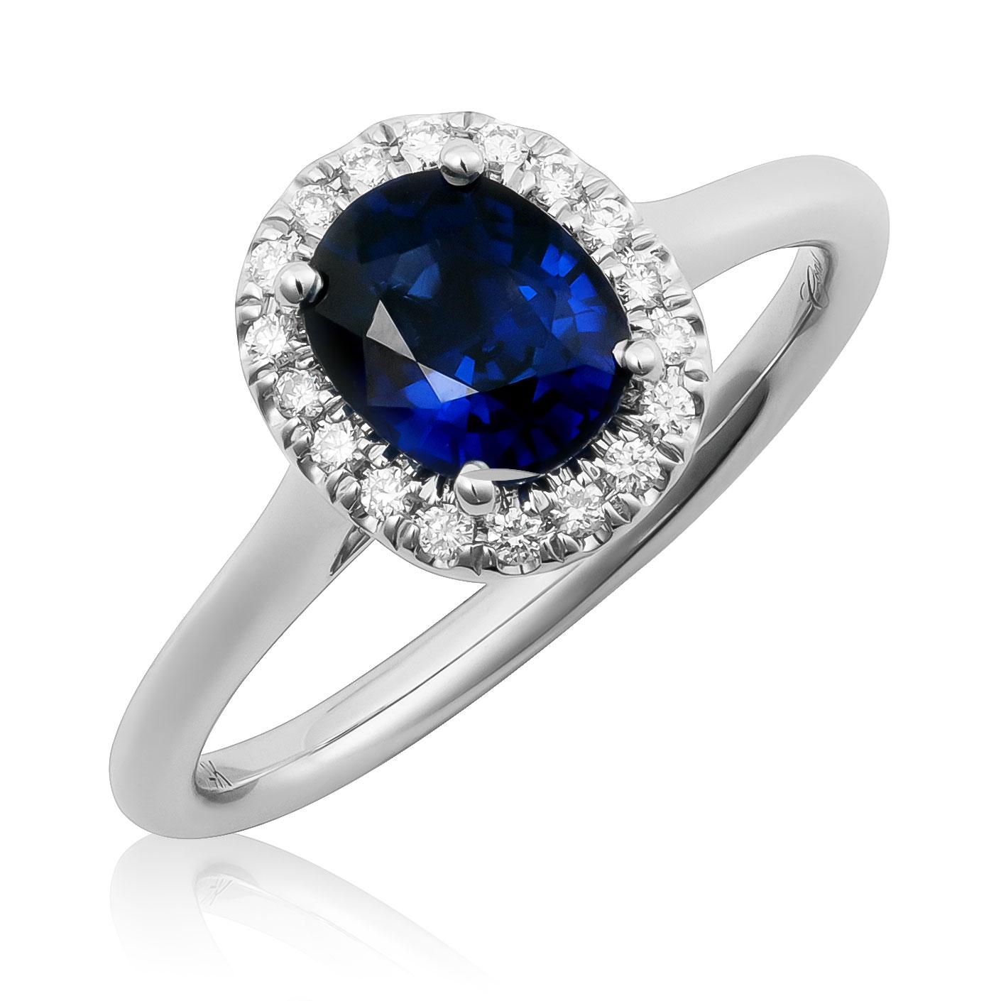 Discover the refined elegance of this 14K white gold ring, showcasing a natural blue sapphire accented with sparkling diamonds. The rich blue oval sapphire, paired with dazzling diamonds, makes this ring an exquisite choice for any occasion.

Center