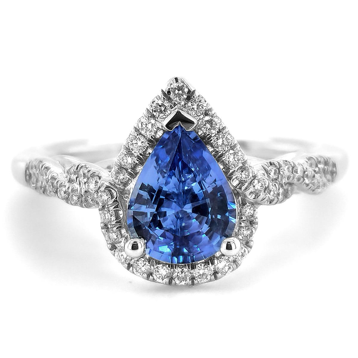 Discover the allure of this stunning 14K white gold ring, showcasing a captivating natural blue sapphire paired with sparkling diamonds. The strong blue hue of the sapphire, enhanced by its elegant pear shape, is beautifully complemented by the