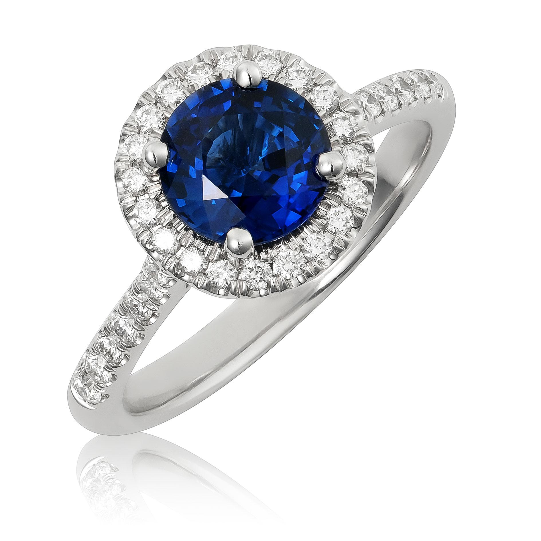 Discover the timeless elegance of this 14K white gold ring, showcasing a natural blue sapphire accented with brilliant diamonds. The vivid blue sapphire, complemented by sparkling diamonds, makes this ring an exquisite choice for adding