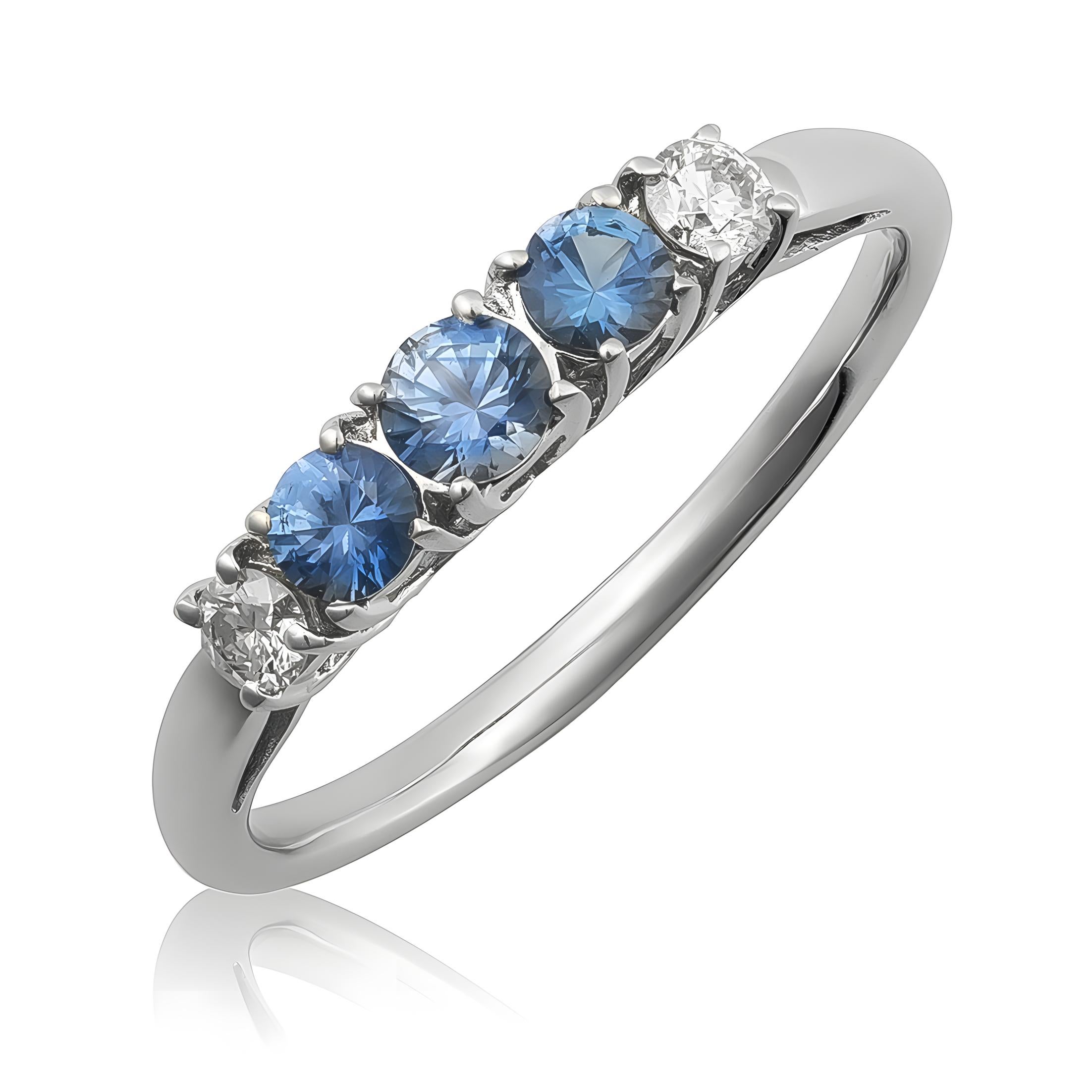 Discover the classic elegance of this 18K white gold ring, featuring natural blue sapphires accented by sparkling diamonds. The vibrant blue sapphires, beautifully complemented by brilliant diamonds, create a timeless piece perfect for adding