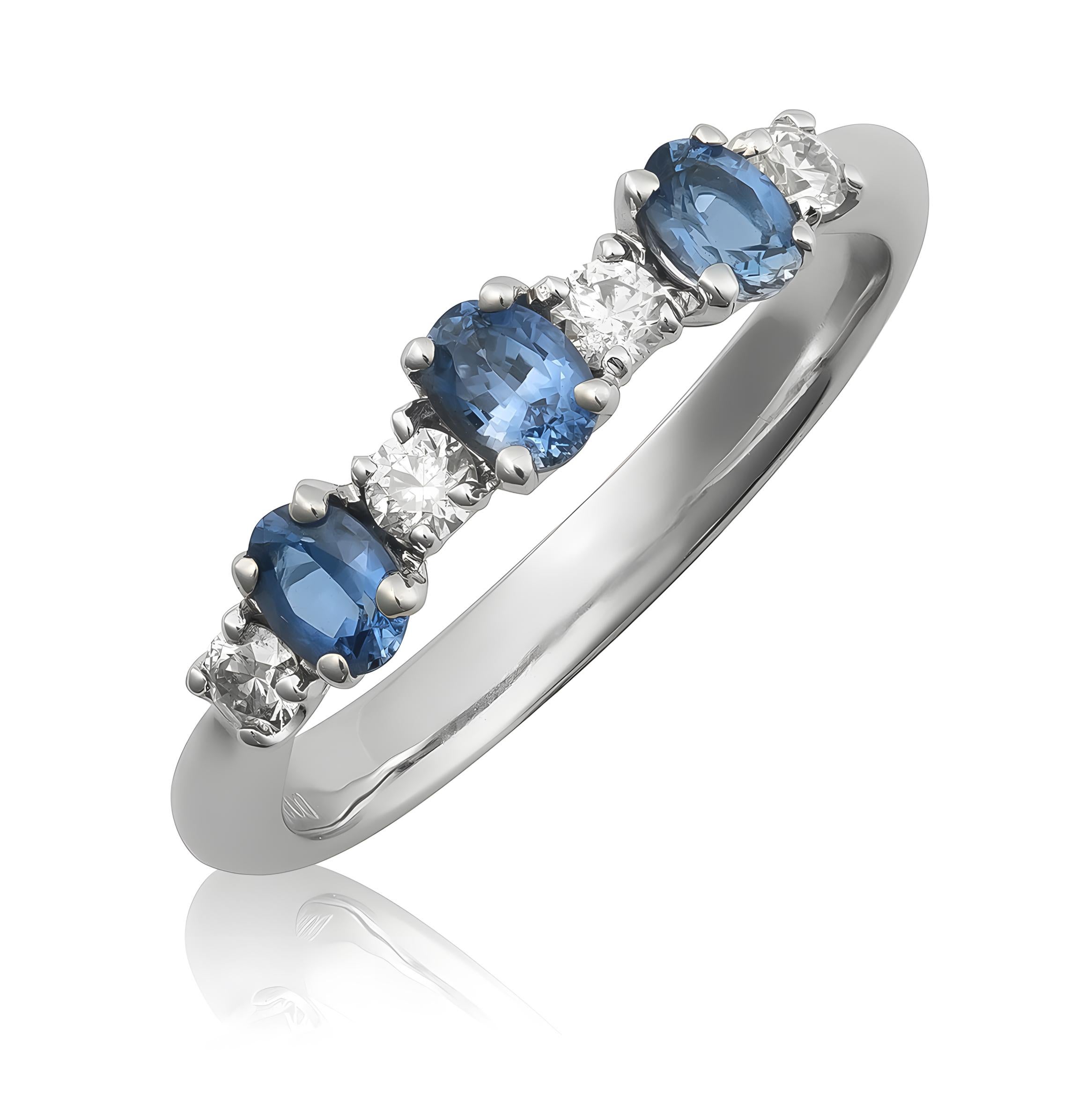Discover the timeless allure of this 18K white gold ring, showcasing natural blue sapphires accented by brilliant diamonds. The vibrant blue sapphires, beautifully paired with sparkling diamonds, make this ring an elegant choice for any