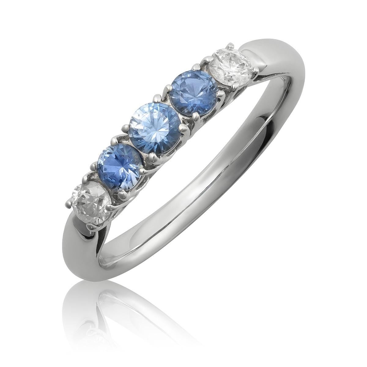 Discover the refined elegance of this 18K white gold ring, featuring natural blue sapphires accented with brilliant diamonds. The vibrant blue sapphires, beautifully complemented by sparkling diamonds, make this ring a sophisticated choice, perfect